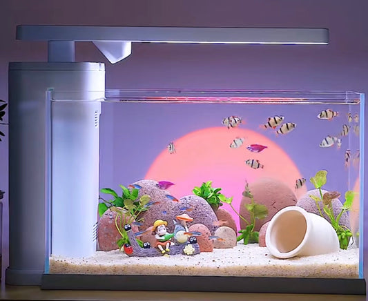 Modern smart aquarium with sunset background, studio ghibli-themed decor, and striped tropical fish swimming under integrated LED lighting